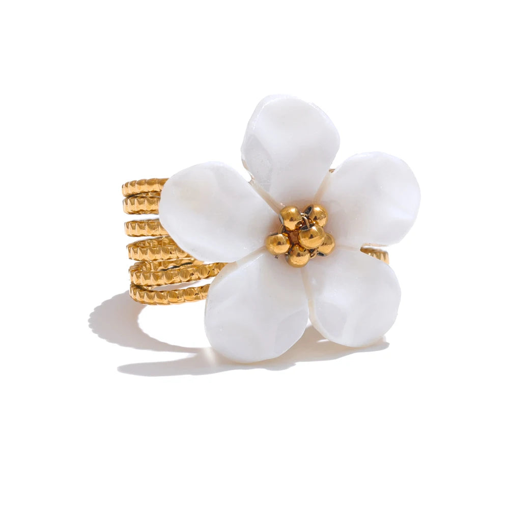 Open ring decorated with a natural shell flower 